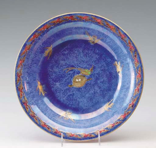 A WEDGWOOD 'FLYING HUMMING BIRDS' ORANGE LUSTRE SHALLOW BOWL,