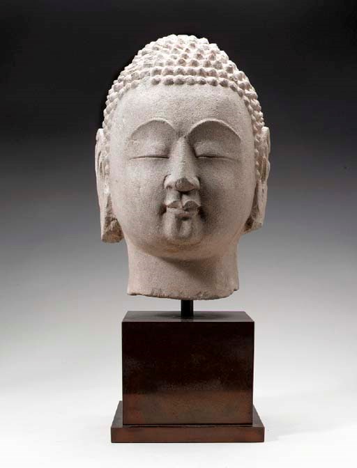 A CHINESE SANDSTONE HEAD OF BUDDHA,