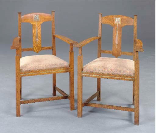 A PAIR OF ARTS AND CRAFTS OAK, PEWTER AND COPPER-INLAID ARMCHAIRS,