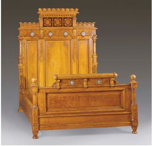 AN AMERICAN ASTHETIC MOVEMENT MARQUETRY INLAID AND TILE-MOUNTED OAK BED,