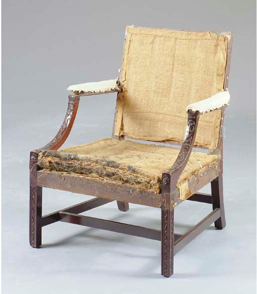 A GEORGE III MAHOGANY LIBRARY ARMCHAIR,