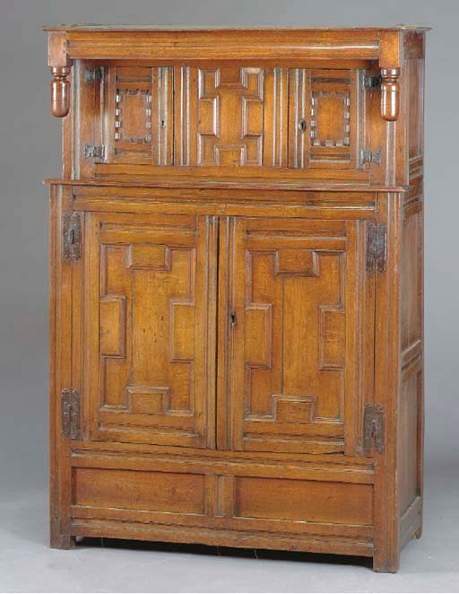 AN ENGLISH OAK PRESS CUPBOARD,