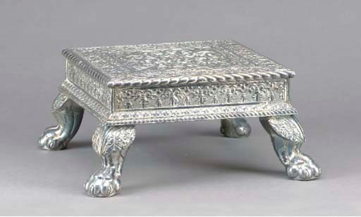 AN ANGLO-INDIAN SILVERED SHEET METAL FOOTSTOOL,