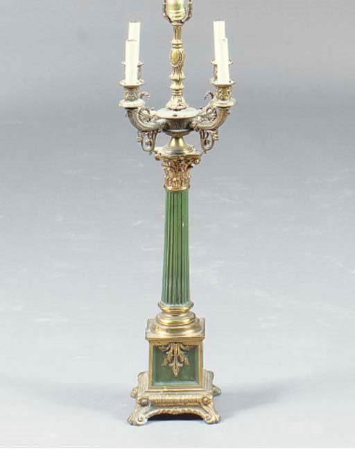 A PATINATED AND PAINT DECORATED BRASS FIVE LIGHT TABLE LAMP,