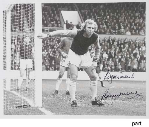 A BLACK AND WHITE AUTOGRAPHED PHOTOGRAPH OF BOBBY MOORE