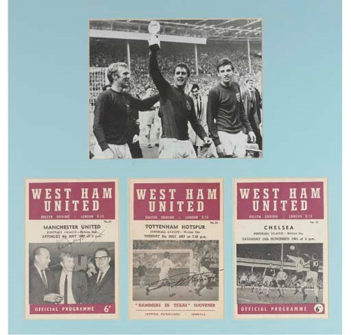 A BLACK AND WHITE REPRODUCTION PHOTOGRAPH OF BOBBY MOORE, GEOFF HURST AND MARTIN PETERS