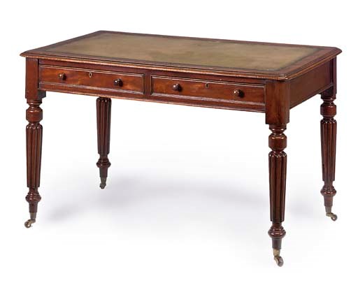 A VICTORIAN MAHOGANY WRITING TABLE