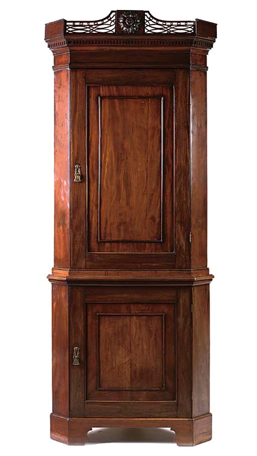 A MAHOGANY CORNER CABINET