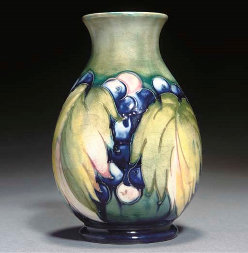 A MOORCROFT LEAF AND BERRY VASE