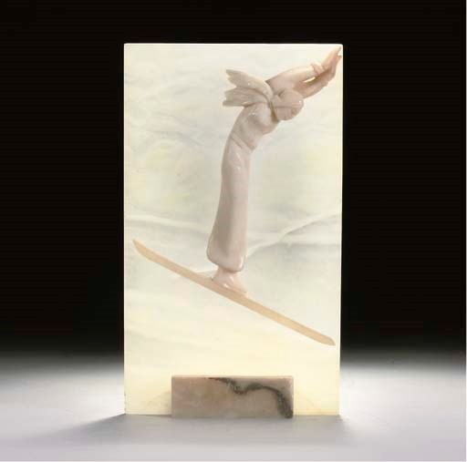 AN ALABASTER LAMP DECORATED WITH A SKIER