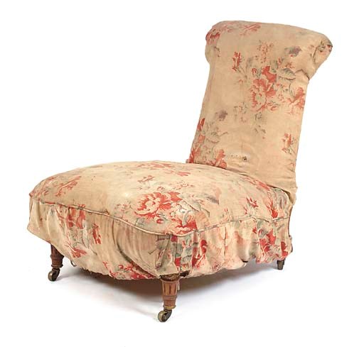 A LATE VICTORIAN WALNUT NURSING CHAIR