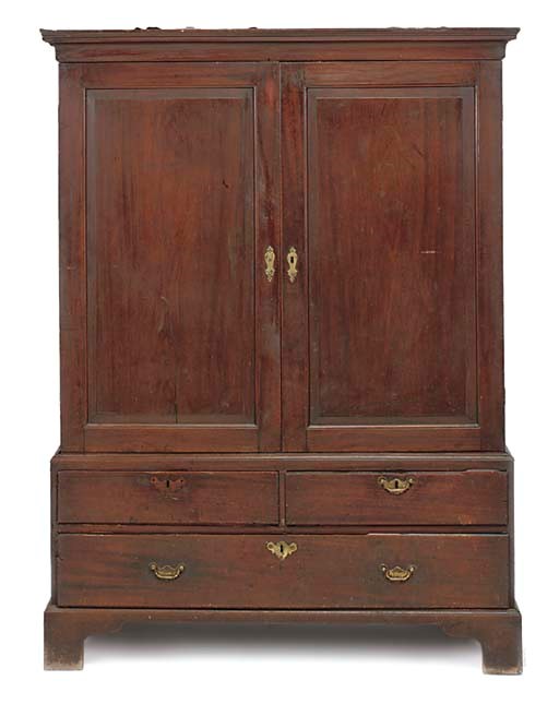 AN EARLY GEORGE III MAHOGANY LINEN PRESS