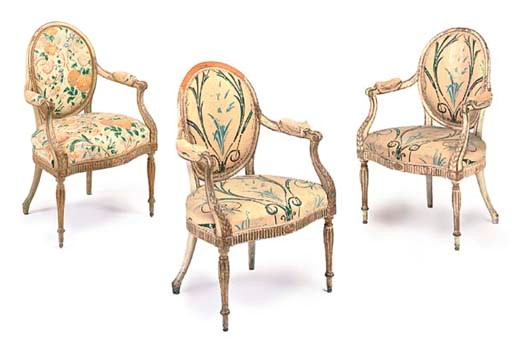 A SET OF THREE GEORGE III CREAM-PAINTED AND PARCEL-GILT OPEN ARMCHAIRS