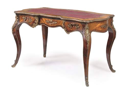 A FRENCH ORMOLU-MOUNTED KINGWOOD SERPENTINE BUREAU PLAT