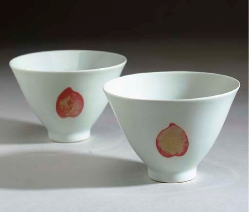 A PAIR OF COPPER-RED-DECORATED CONICAL BOWLS,
