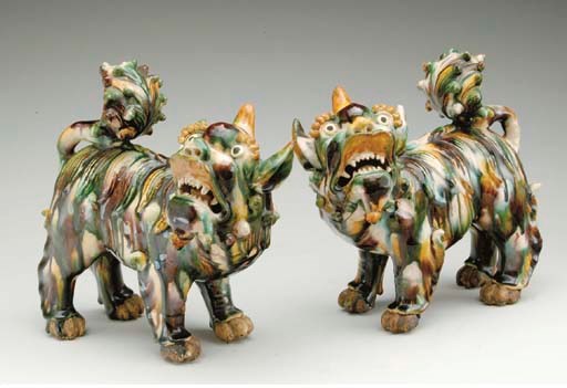 A PAIR OF CHINESE SANCAI-GLAZED MODELS OF BUDDHISTIC LIONS,