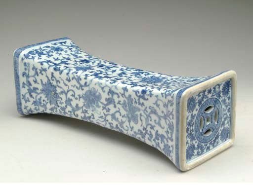 A BLUE AND WHITE INGOT-SHAPED PILLOW,