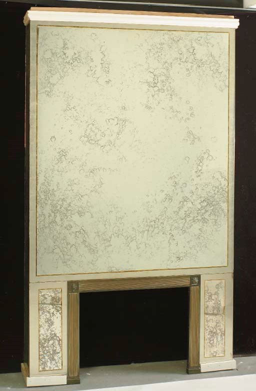 A SMOKED GLASS AND MIRRORED FIREPLACE SURROUND,
