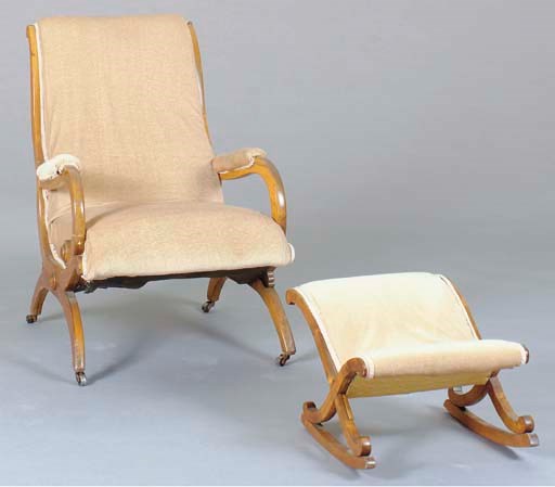 A GERMAN NEOCLASSIC FRUITWOOD ARMCHAIR AND MATCHING OTTOMAN,