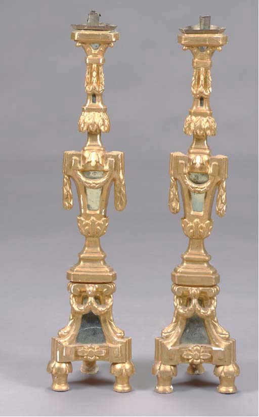 A SET OF FOUR GILTWOOD MIRRORED PRICKETSTICKS,
