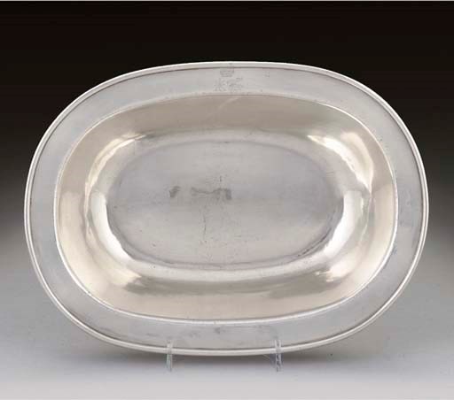 A GEORGE III SILVER PIE DISH,