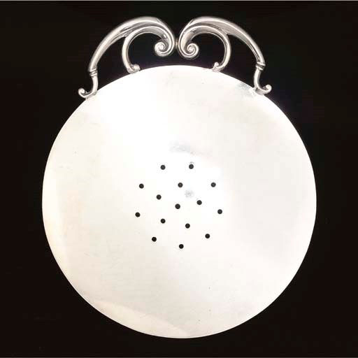 A VICTORIAN SILVER STRAINER,