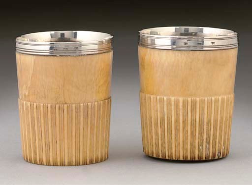A PAIR OF GEORGE III SILVER-MOUNTED IVORY BEAKERS,