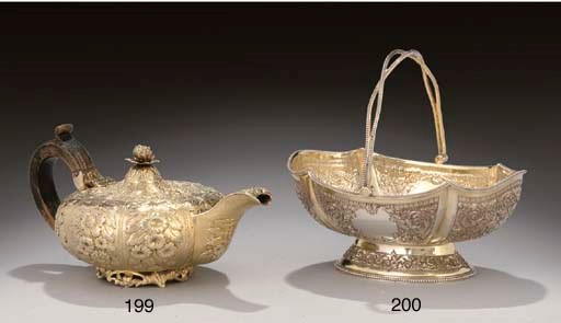 A VICTORIAN PARCEL-GILT SILVER SWING-HANDLED SUGAR BASKET,