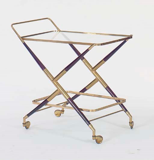 AN EBONISED AND BRASS TWO TIER DRINKS CART,