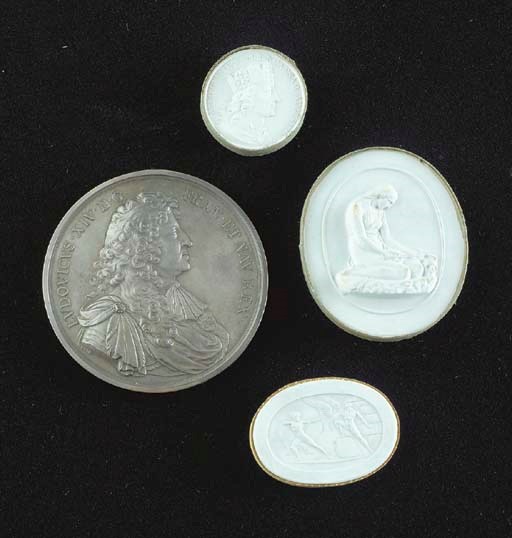 A LARGE GROUP OF PLASTER INTAGLIOS AND PLAQUES WITH BRONZE COMMEMORATIVE MEDALLIONS AND COINS,