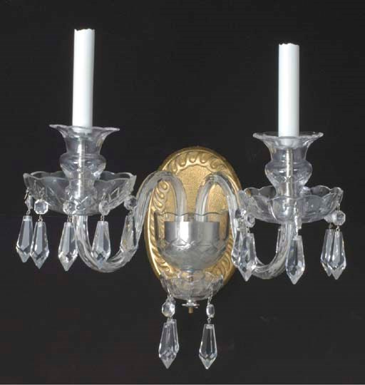 A SET OF FOUR LOUIS XV STYLE CUT GLASS AND GILTWOOD TWIN-BRANCH WALL-LIGHTS,