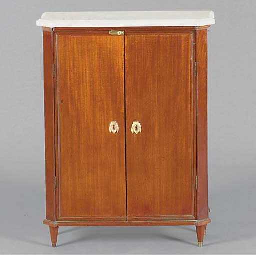 A LOUIS XVI STYLE WHITE MARBLE AND MAHOGANY COMMODE A VANTAUX