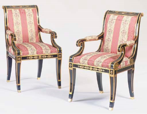 A PAIR OF REGENCY STYLE EBONISED AND PARCEL-GILT OPEN ARMCHAIRS,