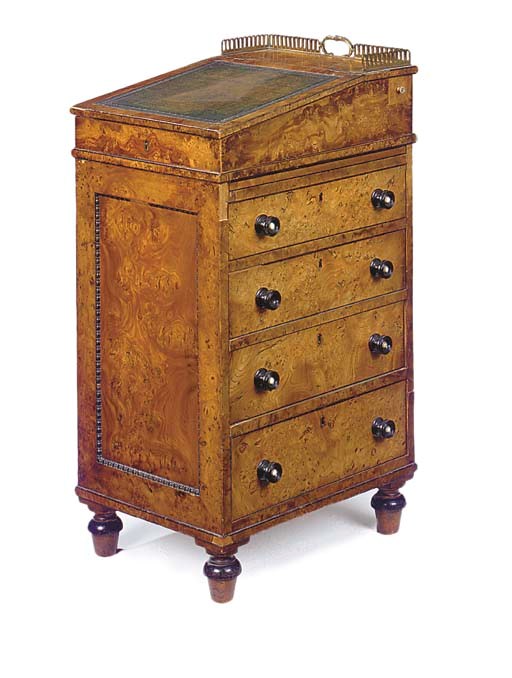 A REGENCY BURR ELM AND EBONISED DAVENPORT