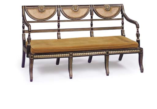 A REGENCY SIMULATED ROSEWOOD, PARCEL GILT AND CANED SOFA