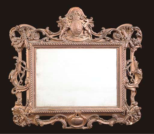 A GEORGE IV GILT COMPOSITION MIRROR