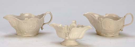THREE STAFFORDSHIRE WHITE SALT-GLAZE STONEWARE SAUCEBOATS,