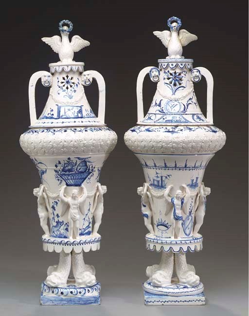 A PAIR OF DELFT BLUE AND WHITE VASES AND COVERS,