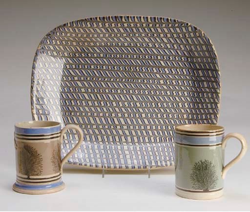TWO ENGLISH MOCHAWARE IMPERIAL PINT MUGS AND TWO OVAL PLATTERS,