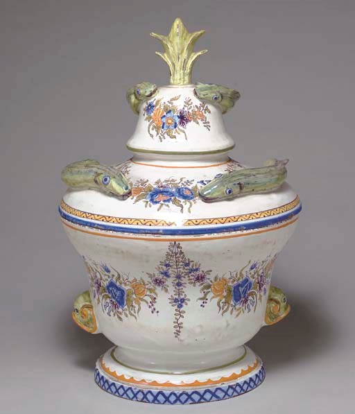 A FRENCH FAIENCE EEL TUREEN AND COVER,