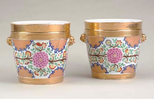 A PAIR OF CONTINENTAL PORCELAIN GILT AND PAINTED JARDINIERES,