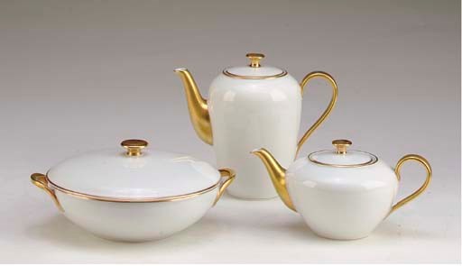 A GERMAN GOLD-BANDED PORCELAIN PART DINNER SERVICE,