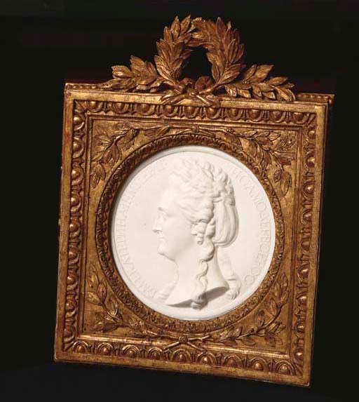 A LOUIS XVI SEVRES BISCUIT MEDALLION IN A GILTWOOD FRAME