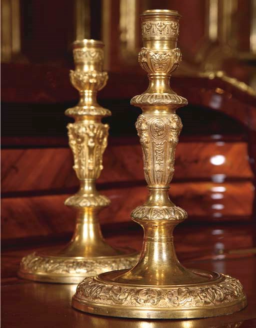 A PAIR OF REGENCE ORMOLU CANDLESTICKS