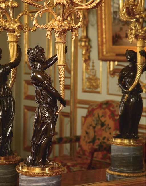 A PAIR OF LOUIS XVI ORMOLU, PATINATED BRONZE AND BLEU TURQUIN FOUR-LIGHT CANDELABRA