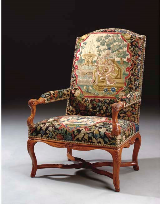 A REGENCE WALNUT AND NEEDLEWORK FAUTEUIL