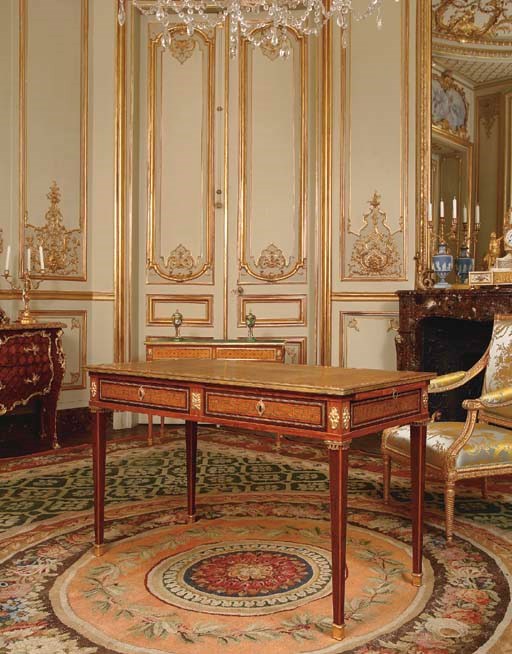 A LOUIS XVI ORMOLU-MOUNTED TULIPWOOD, AMARANTH AND PARQUETRY BUREAU PLAT