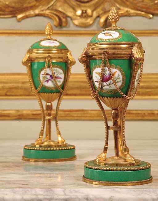 A PAIR OF ORMOLU-MOUNTED GREEN-GROUND PORCELAIN CASSOLETTE VASES