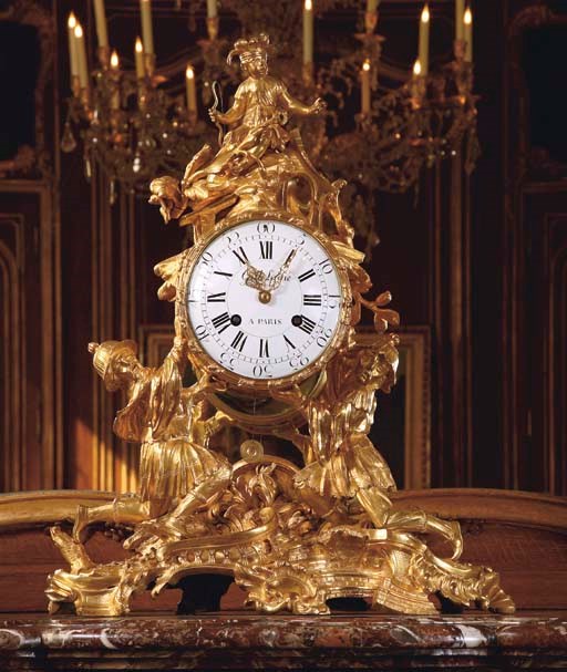 A LOUIS XV ORMOLU MANTEL CLOCK