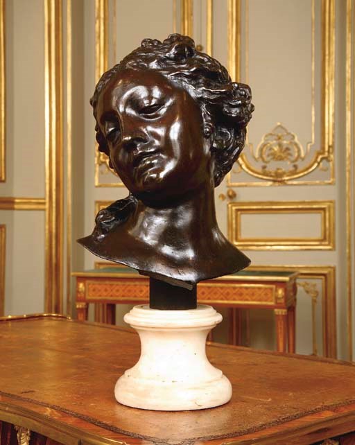 A FRENCH BRONZE BUST OF A YOUNG LADY